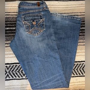 Bootcut Jeans
- People’s Liberation 
- Size 7/8
- Medium wash colored